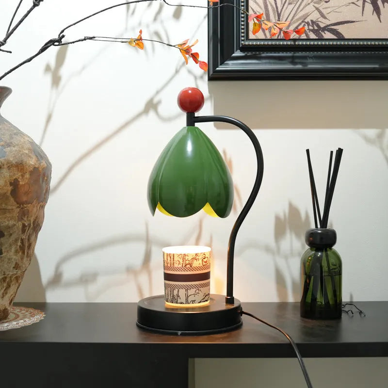Linglan modern style melting wax fragrance lamp with metal holder on a desk.