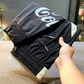 Black men's casual cropped trousers with banded ankle, made from ultra-thin ice silk cotton fabric.