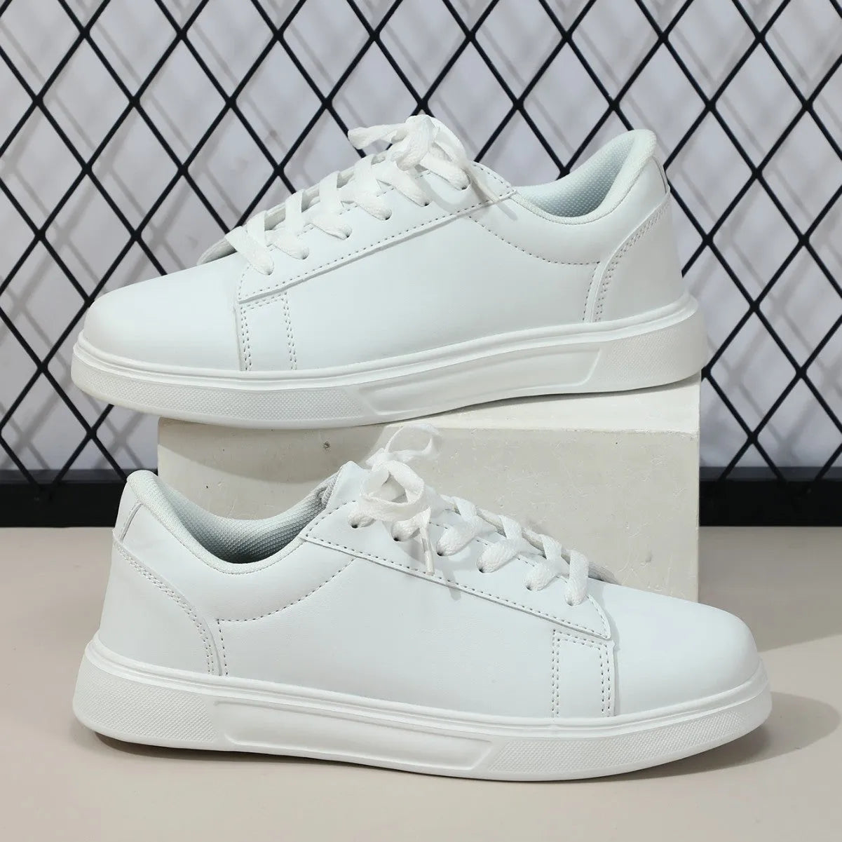 Women's beige brown platform skateboard sneakers with a cross strap and flat rubber sole.