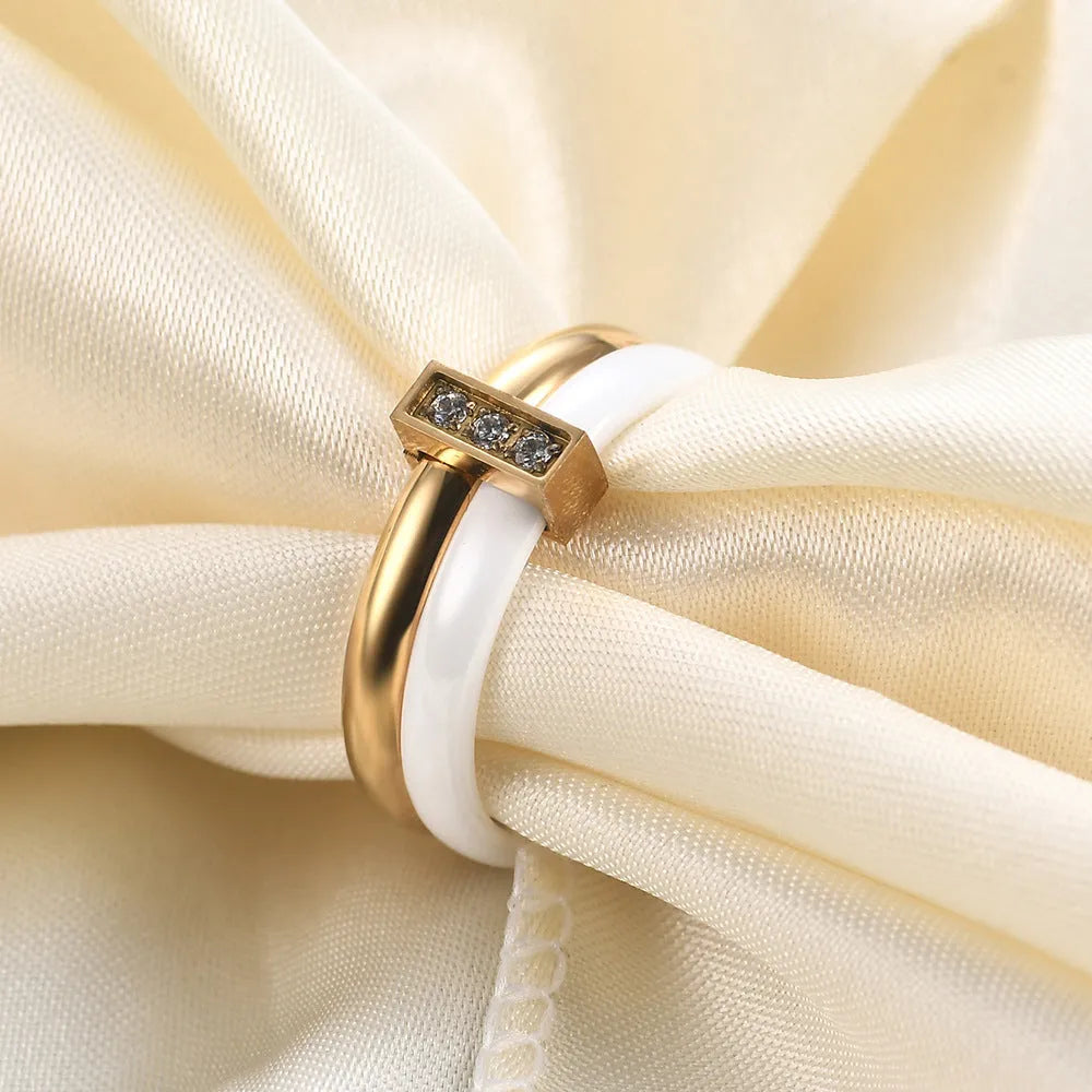 Geometric ceramic women's ring with zirconium detailing in steel black or gold white finish