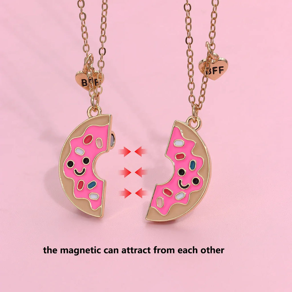 Two matching zinc alloy pendants in donut and watermelon shapes with glossy oil drip finish on cross chains