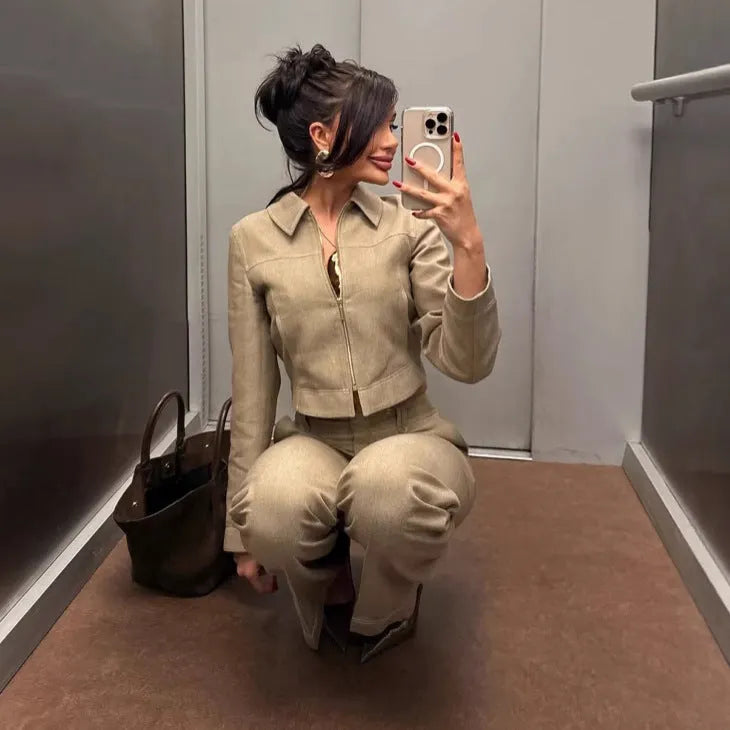 Women's beige herringbone pattern jacket and trousers suit set with 3D embroidery detail.