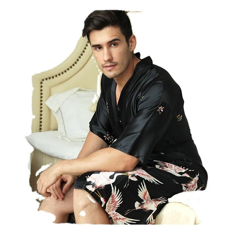 Mid-length printed artificial silk men's nightgown in cardigan style, black colour, on a hanger