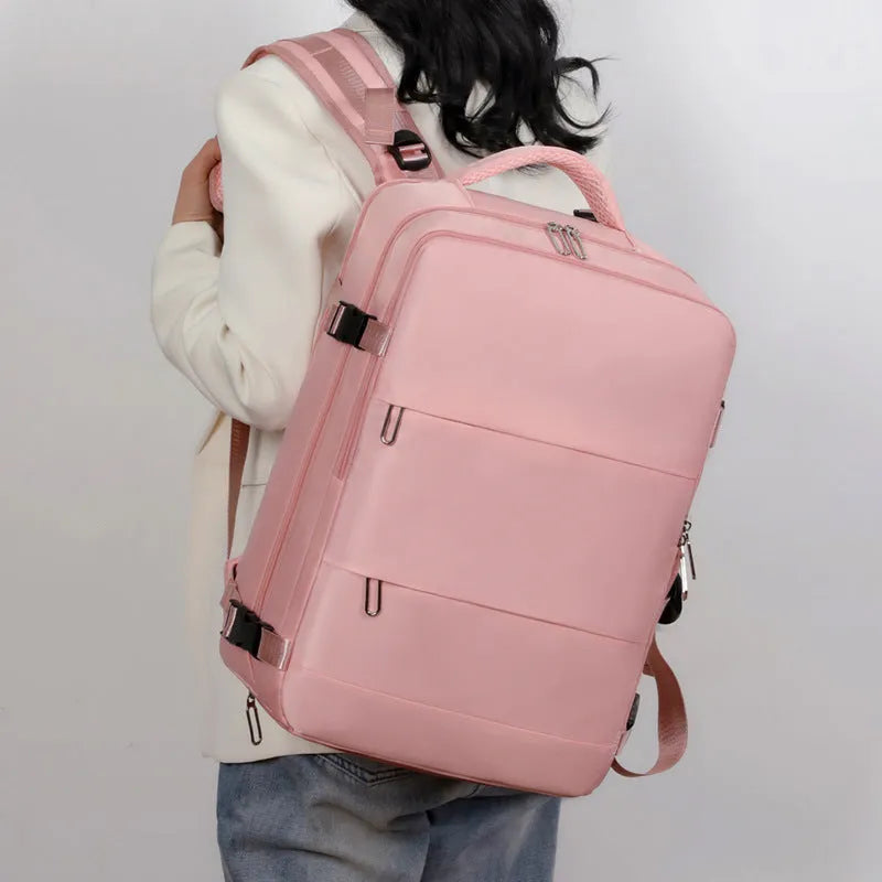 Large purple waterproof travel backpack for women with multiple compartments and an air pillow belt strap.