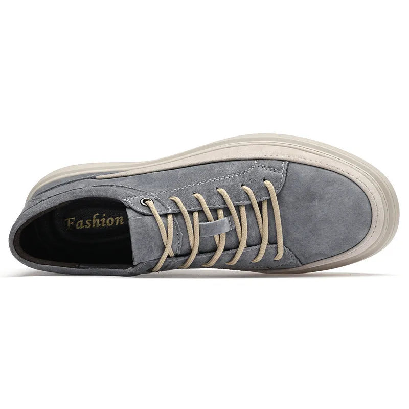 Men's grey low-top casual skate shoes with pigskin upper and rubber sole, shown from the side.