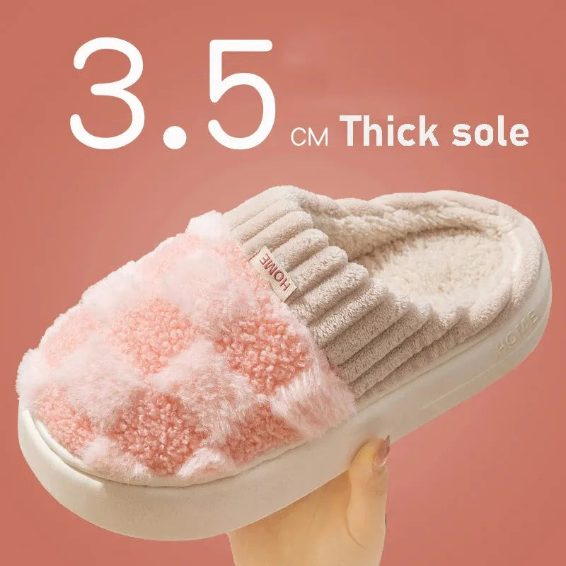 Women's plaid patterned plush slippers with non-slip sole in multiple colours on a wooden floor.