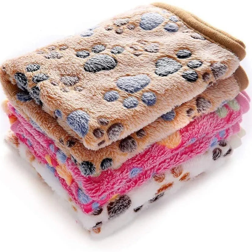 Coral fleece dog blanket with paw print design, shown in camel colour, size L (100x120 cm).
