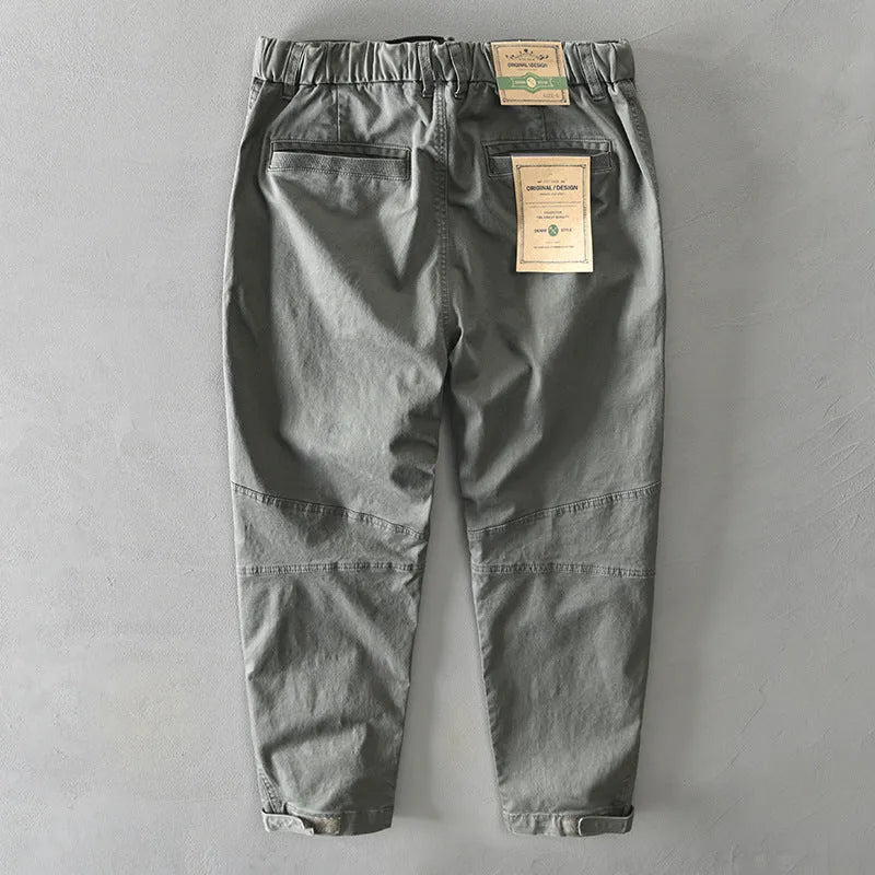 Men's cotton overalls with elastic waistband in army green colour showing loose trousers design