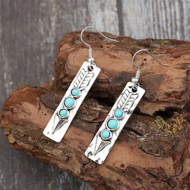 Women's silver geometric earrings with turquoise inlay detailing on long strip alloy design