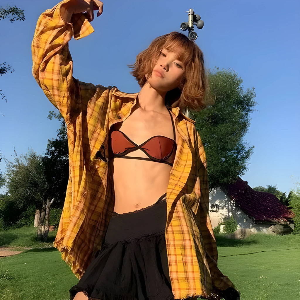 Man and woman modelling a loose-fit dopamine yellow plaid casual shirt.