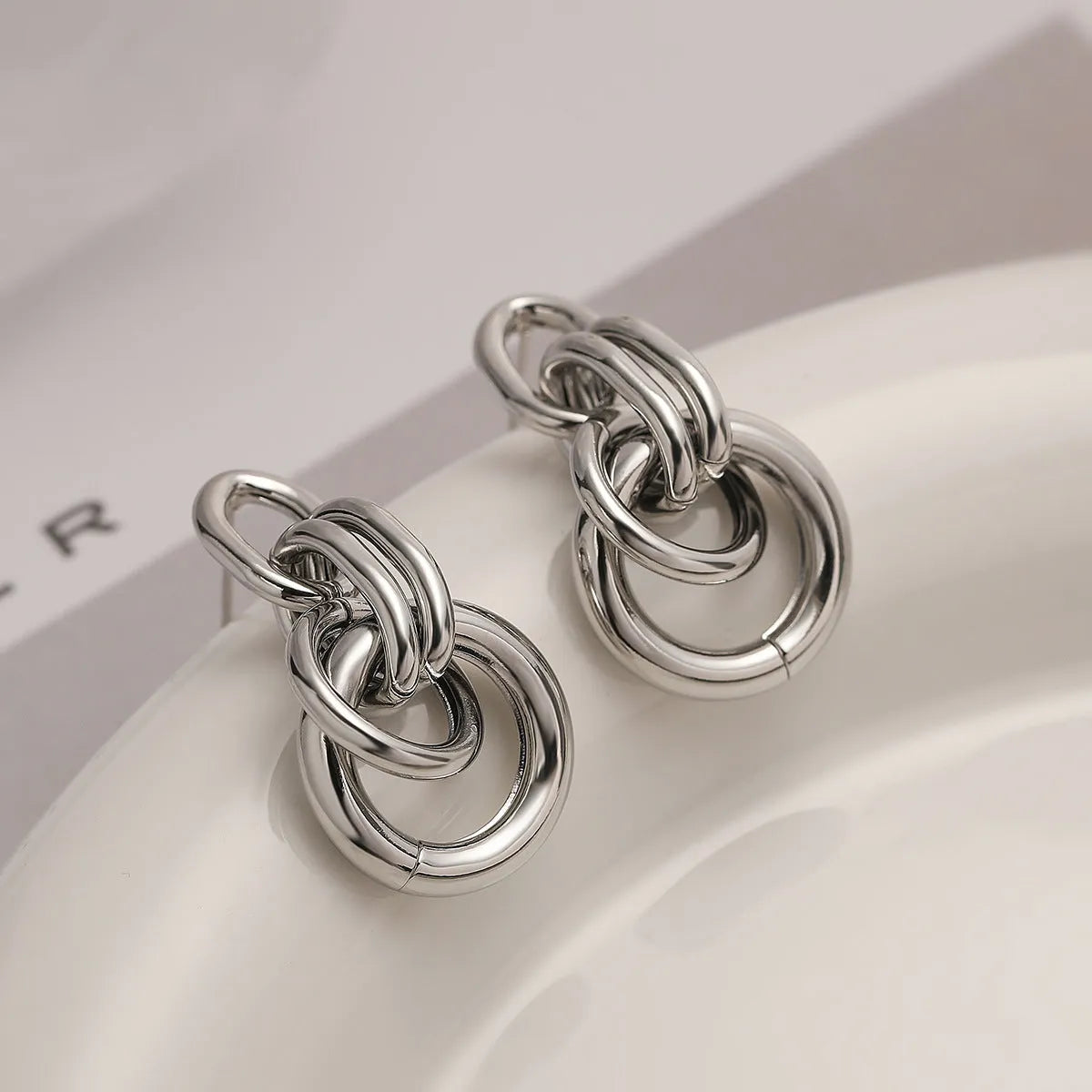 Gold geometric earrings with irregular asymmetric design and INS high-profile styling