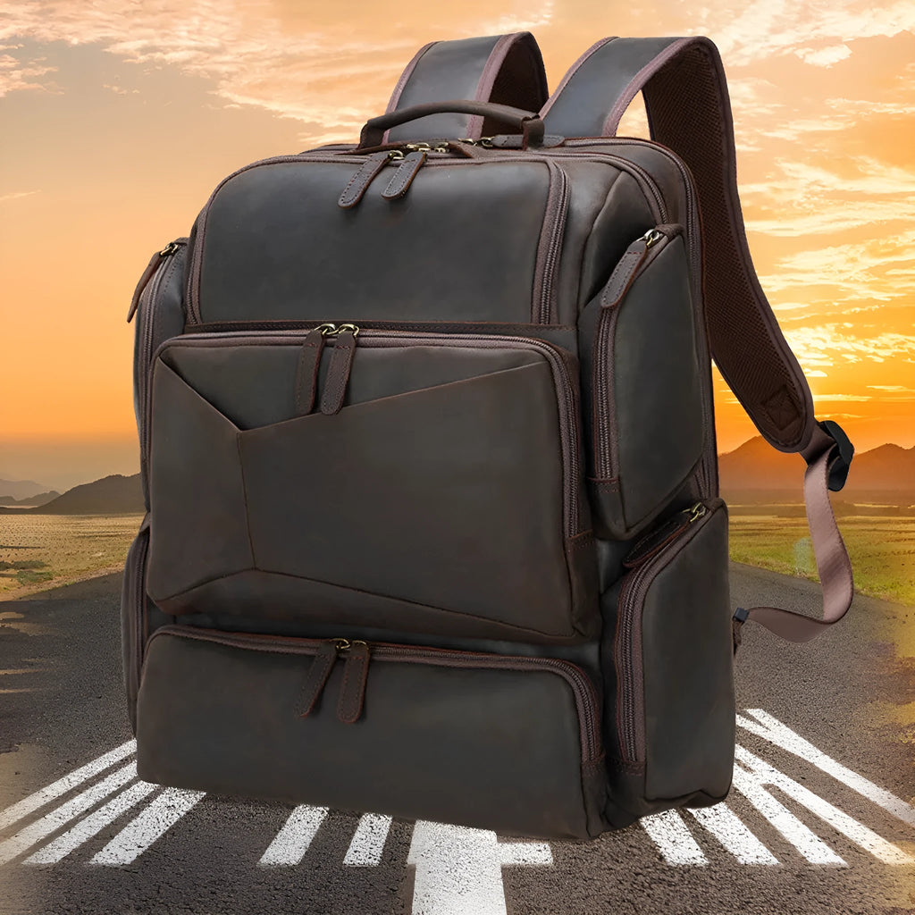 Dark brown leather backpack with 17-inch laptop compartment and multiple internal pockets