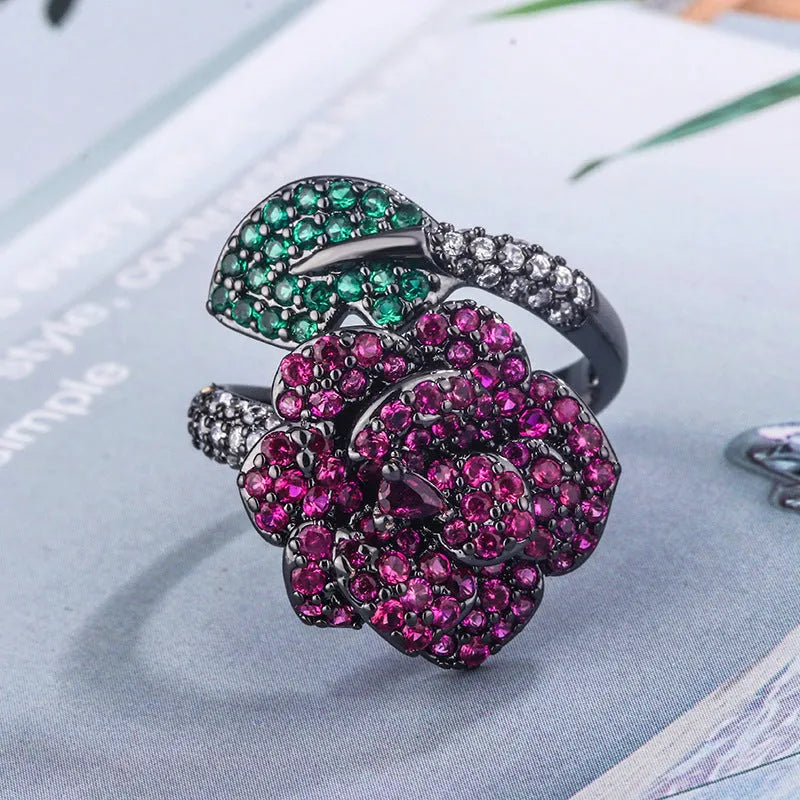 Gold-plated black gold ring with geometric shape and floral design featuring simulation red corundum elements
