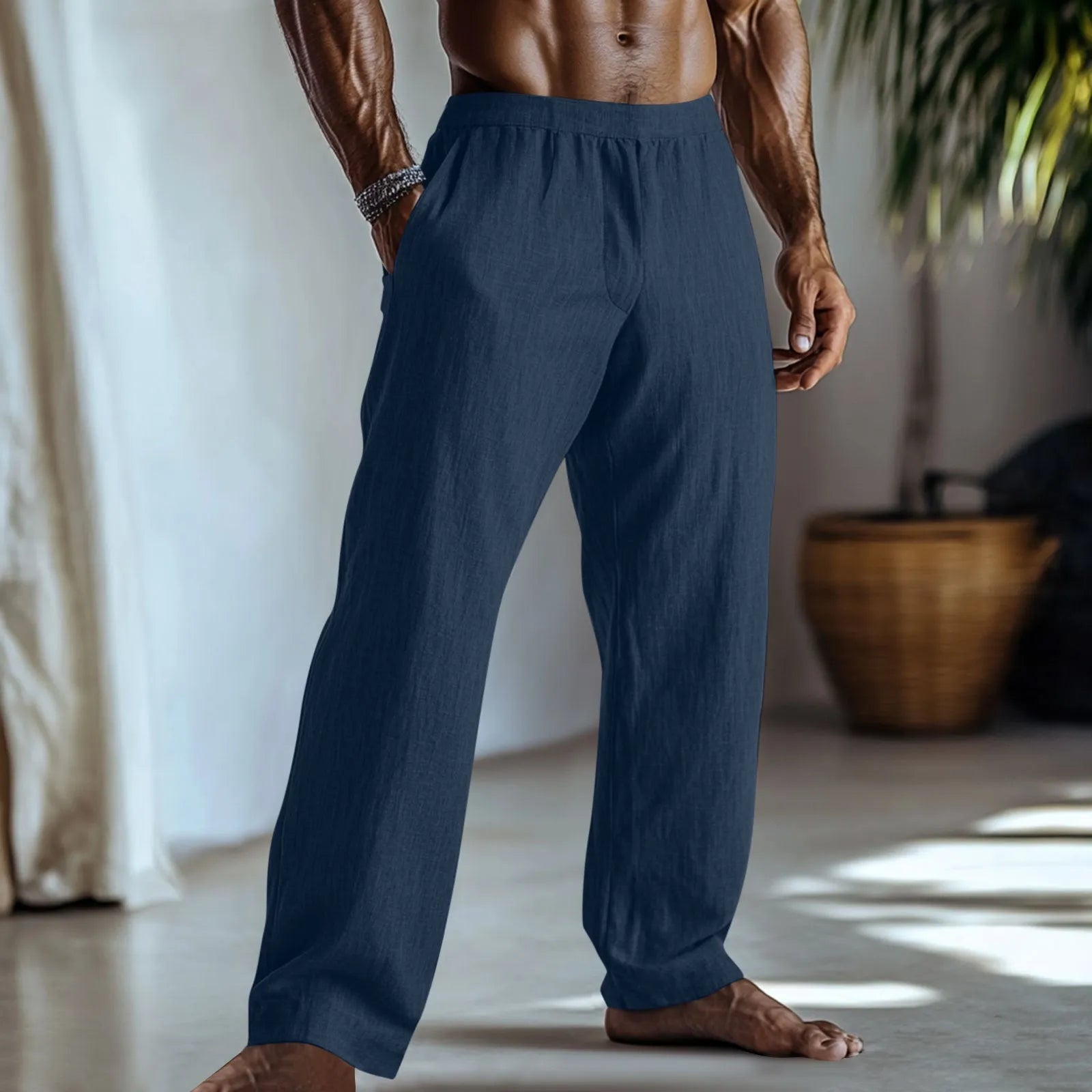 Straight-leg casual trousers in cotton and linen fabric on a hanger, showing light green colour and pocket detail
