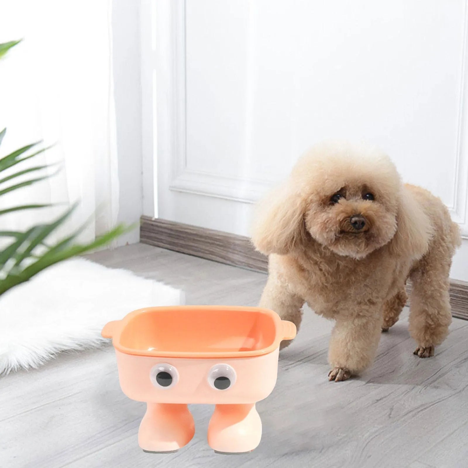 Green robot-shaped tilted cat bowl with detachable inner dish on a non-slip base.