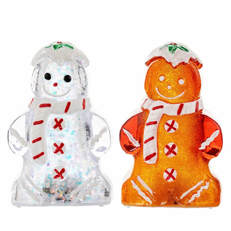 Glowing red-scarf gingerbread man Christmas ornament with modern design on a green tree branch.