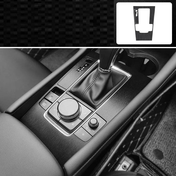 Car interior decorative film sticker kit showing carbon fibre pattern applied to centre console and dashboard