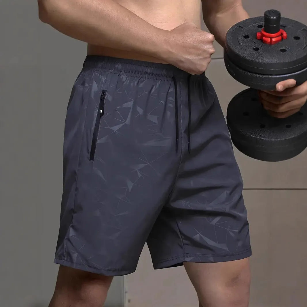 Men's loose fit casual sports shorts in blue, shown from the front on a model.