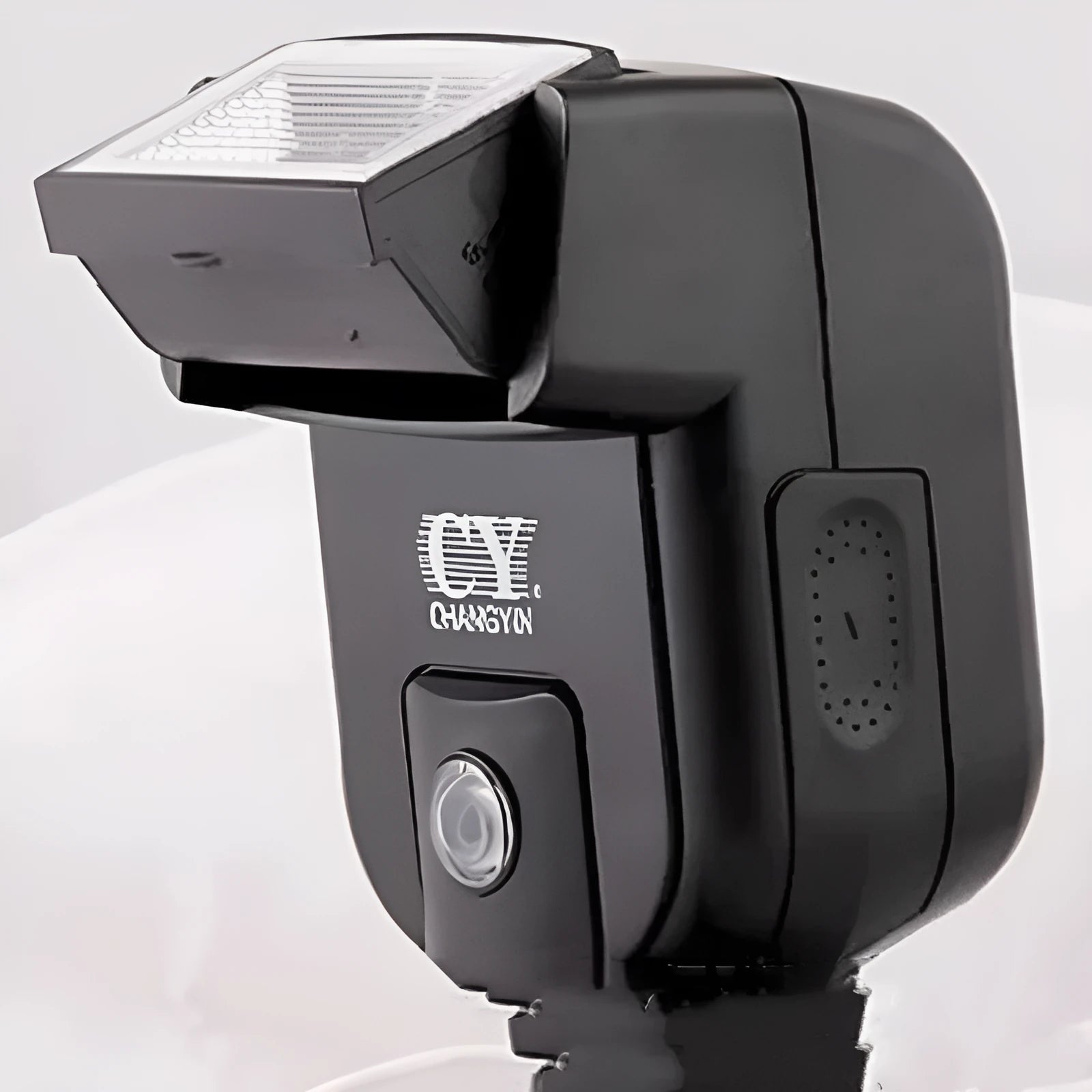 Compact SLR camera flash unit with its head tilted upwards, showing hot shoe mount.