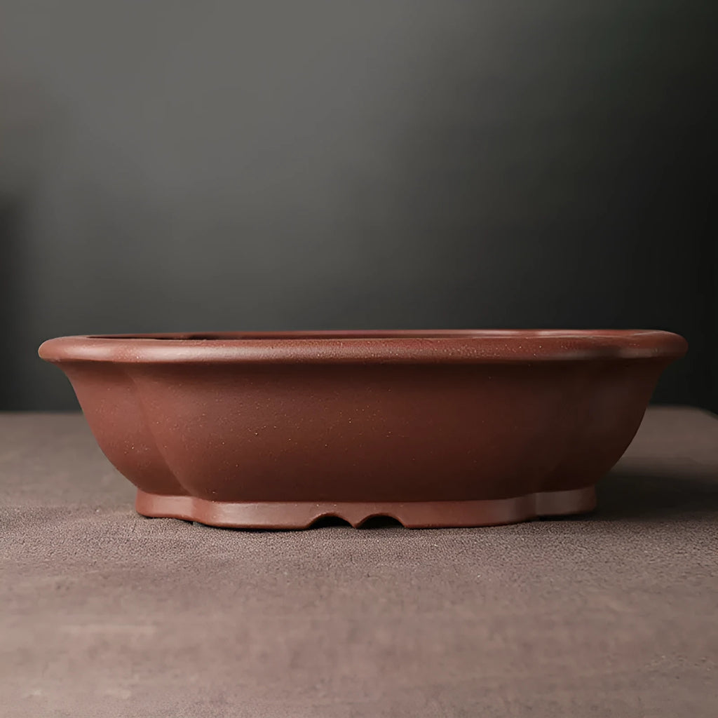 Handmade purple clay bonsai basin in plain Chinese style, shallow rectangular shape.