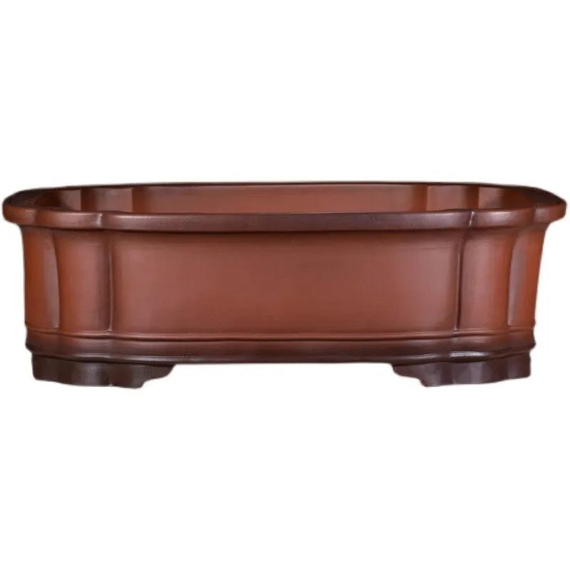 Large antique-finish Chinese purple clay flower pot with detailed tree stump and floral motif sculpture.