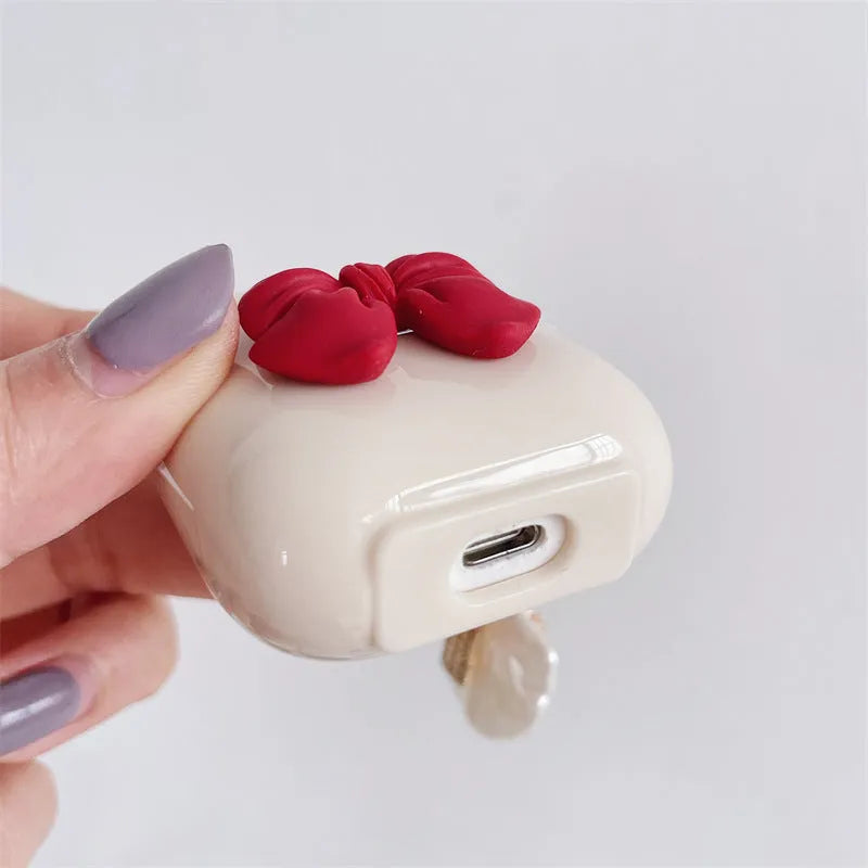 Beige red bow shell TPU case for AirPods wireless earbuds with clamshell design