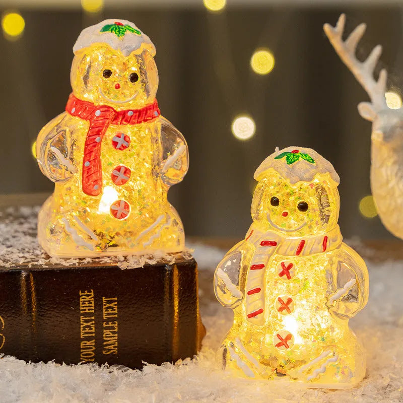 Glowing red-scarf gingerbread man Christmas ornament with modern design on a green tree branch.