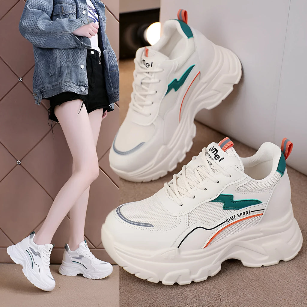 Women's white low-top dad shoes with cross straps and lace-up front