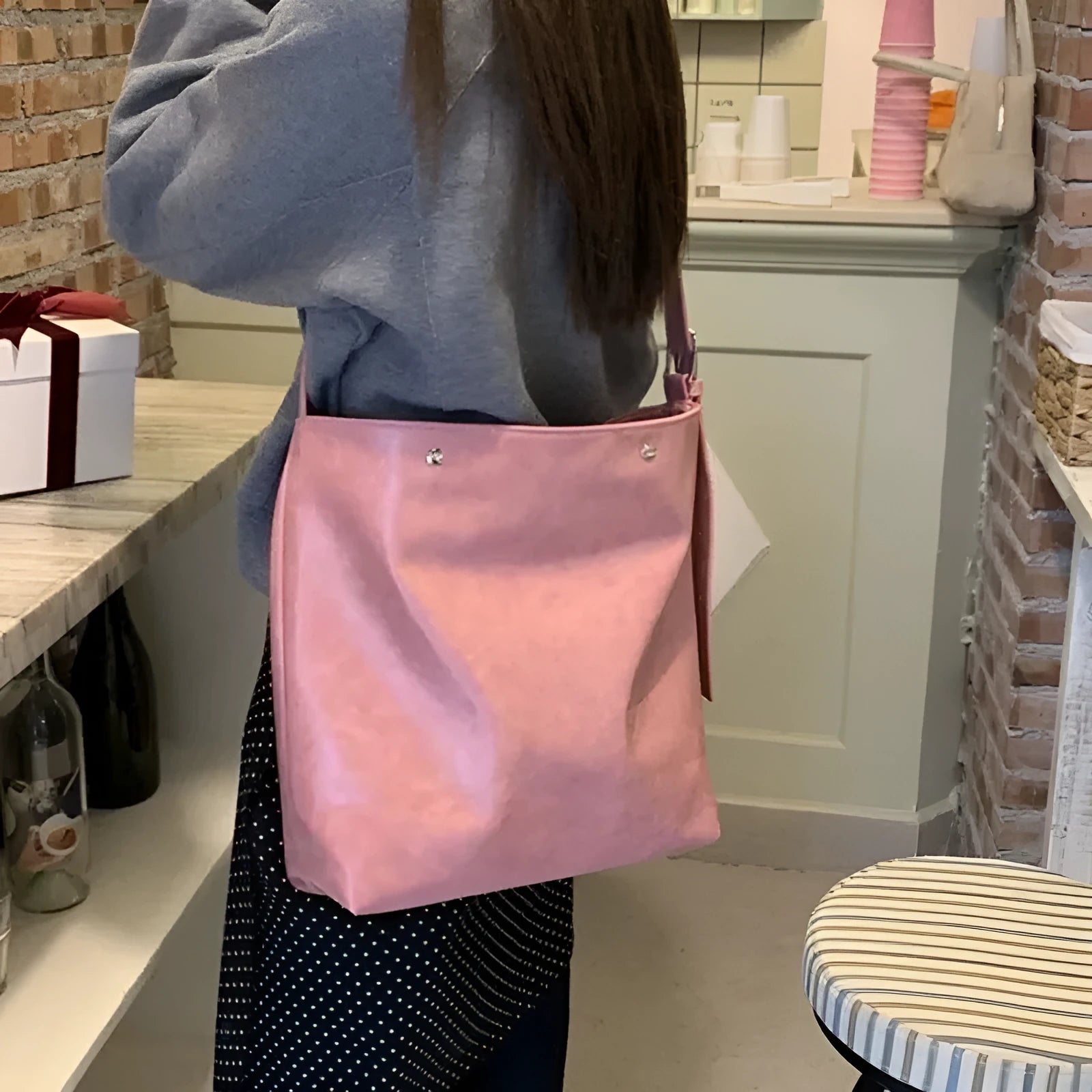Corduroy one-shoulder commuter bag with pink or brown colour options showing 39cm length dimension