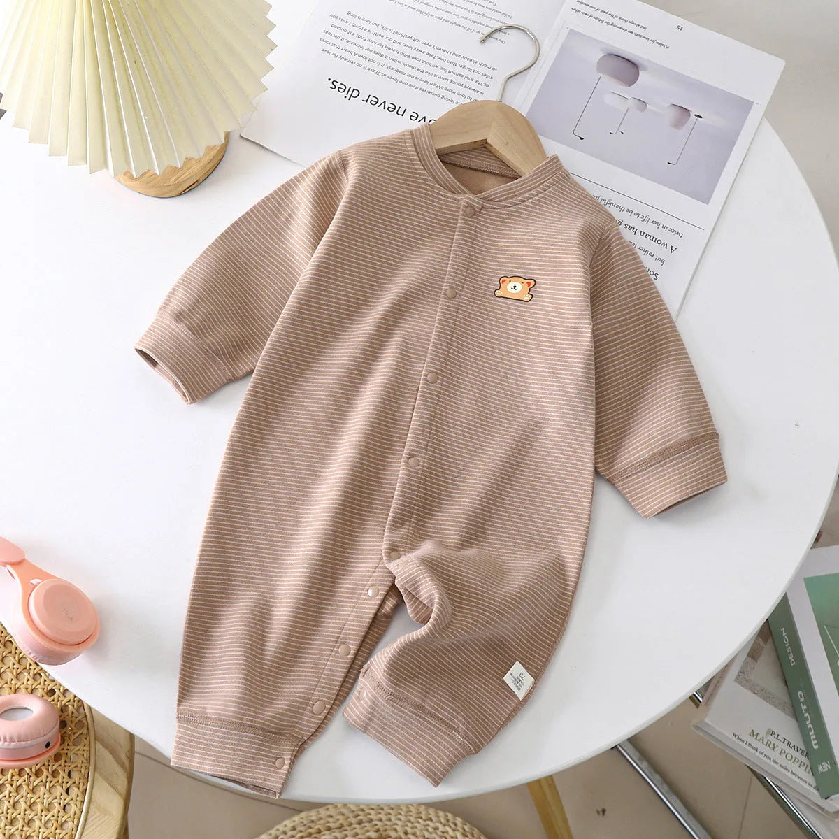 Baby Dralon striped jumpsuit romper in bean green with long sleeves and hide hook closure on white background