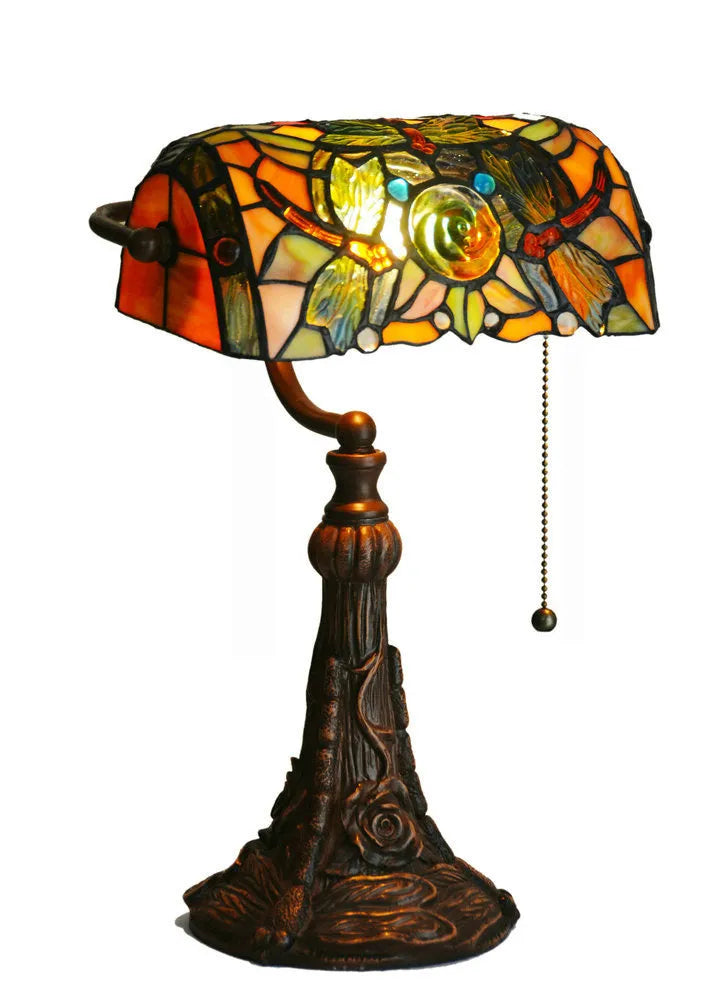 Tiffany table lamp with coloured glass shade on resin base, 36cm tall