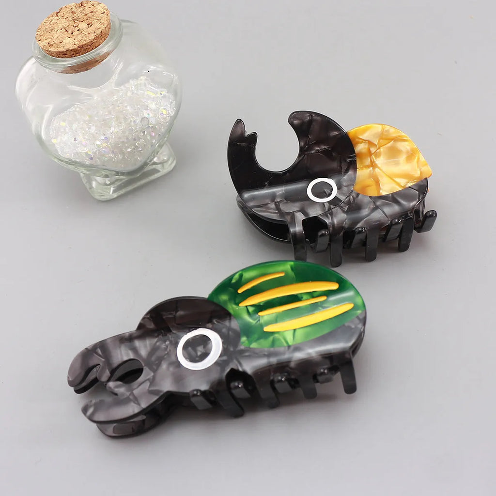 Handmade cellulose acetate beetle grip in cartoon style for insect biology observation