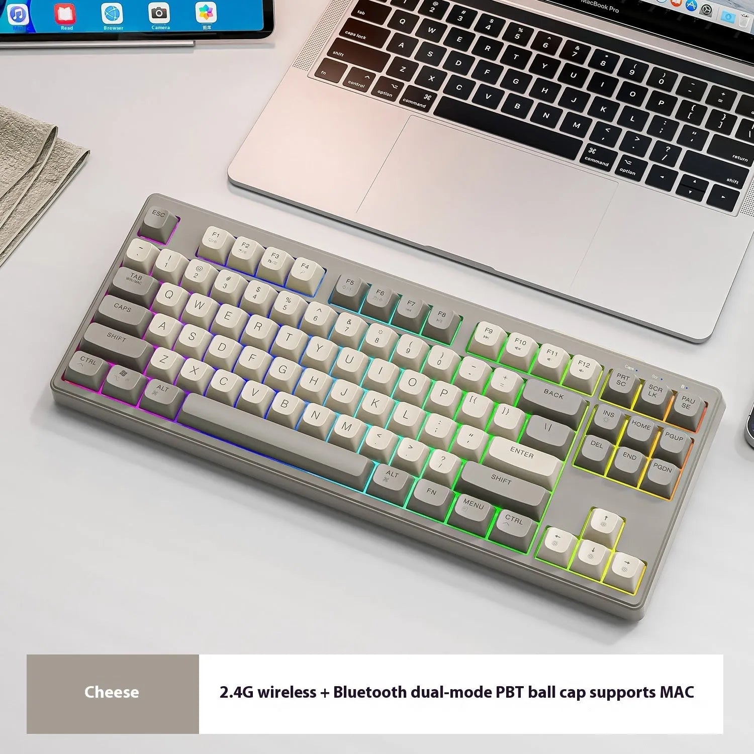 Free Wolf M87 wireless dual-mode keyboard in blueberry colour on a desk with USB receiver and cable.