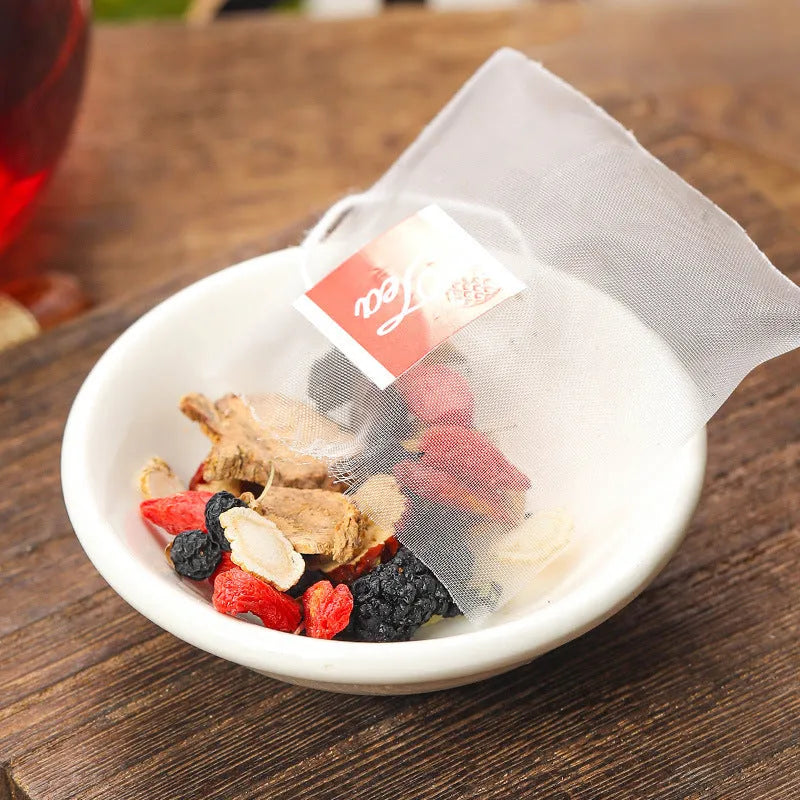 A bag of ginseng and black wolfberry tea containing 40 individual 5g sachets.