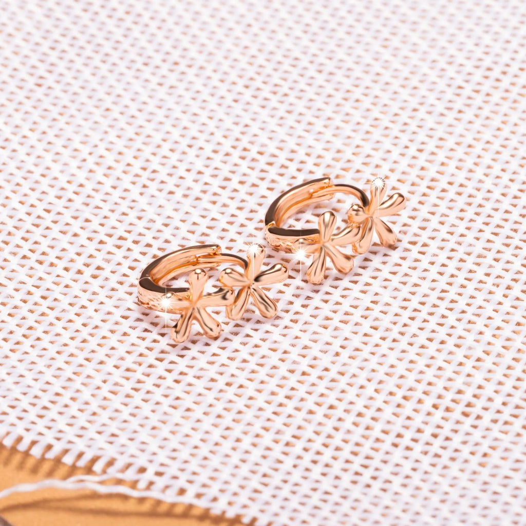 Circular rose gold earrings featuring a waterdrop flower design for women.