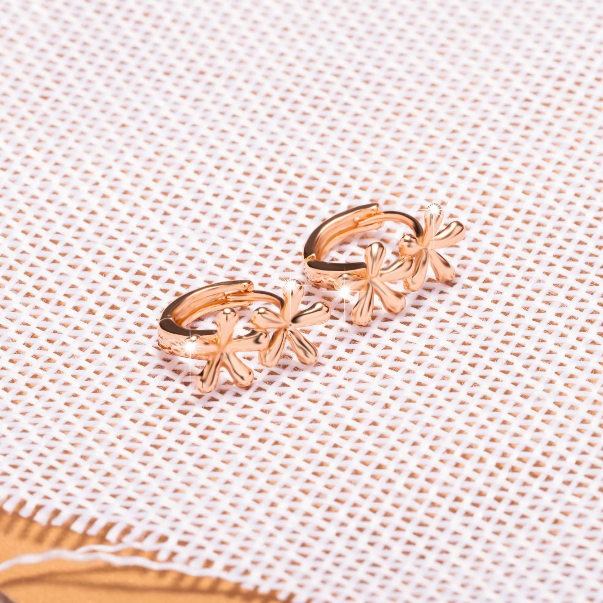 Circular rose gold earrings featuring a waterdrop flower design for women.