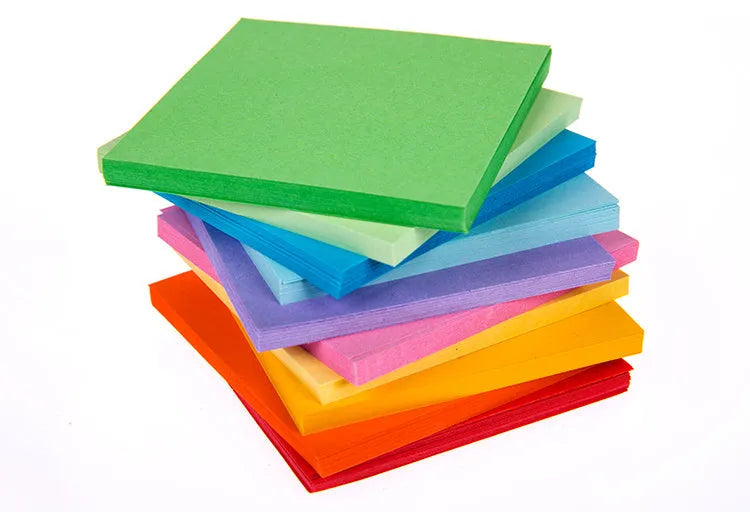 Assorted coloured mini paper scrolls with metal eyelets in sizes 3x7cm, 4x7cm, 5x5cm and 7x7cm.