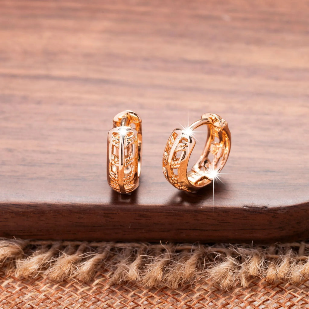 Rose gold plated hollowed-out copper earrings in a leaf shape design