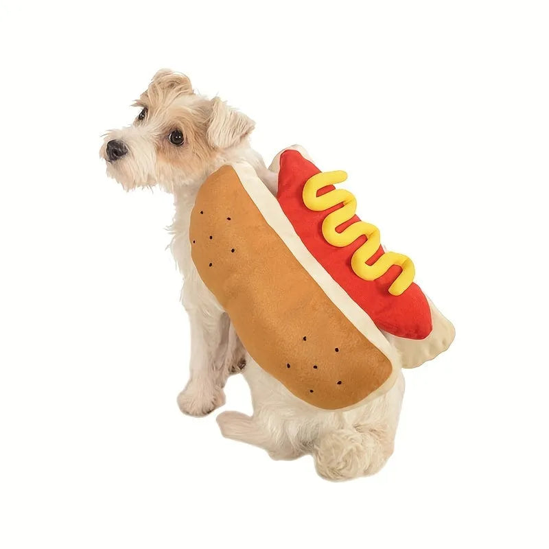 Small dog wearing a red and brown full-body hot dog costume with a bun-shaped hood.