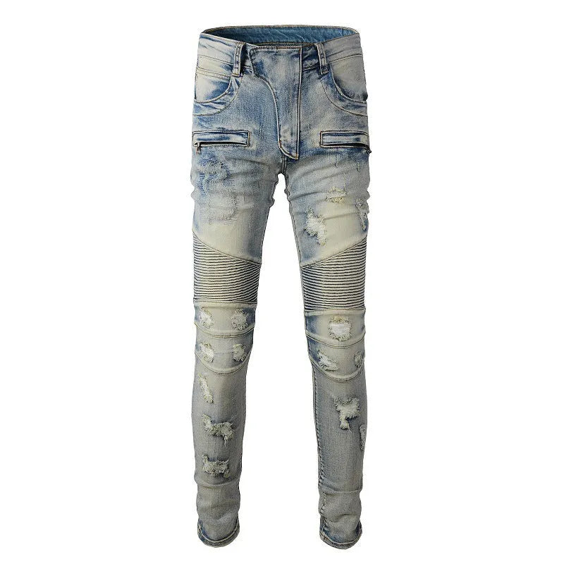 Light blue men's slim fit distressed jeans with hand-frayed details on a mid-waist, showing a zipper fly and straight leg cut.