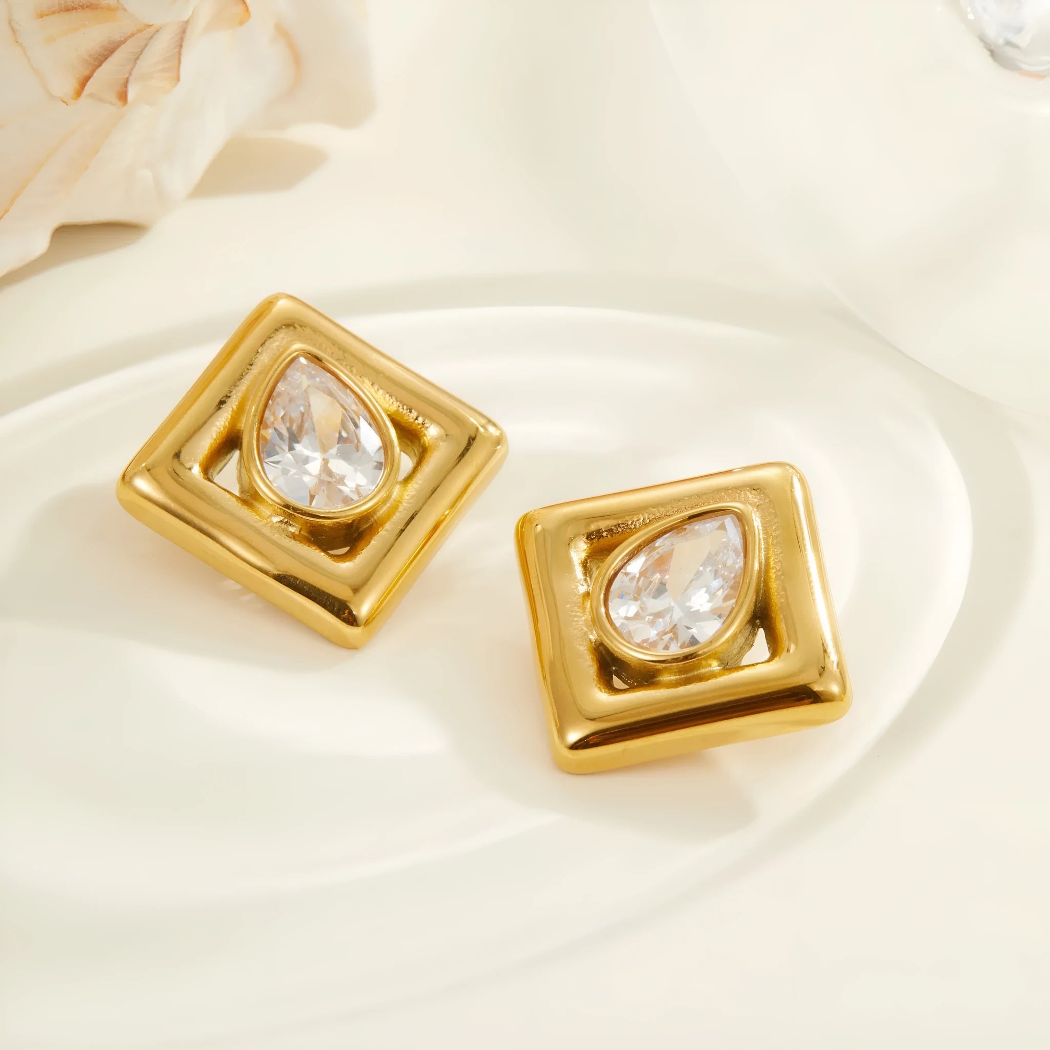 Gold plated geometric stud earrings with water drop zircon inlaid design