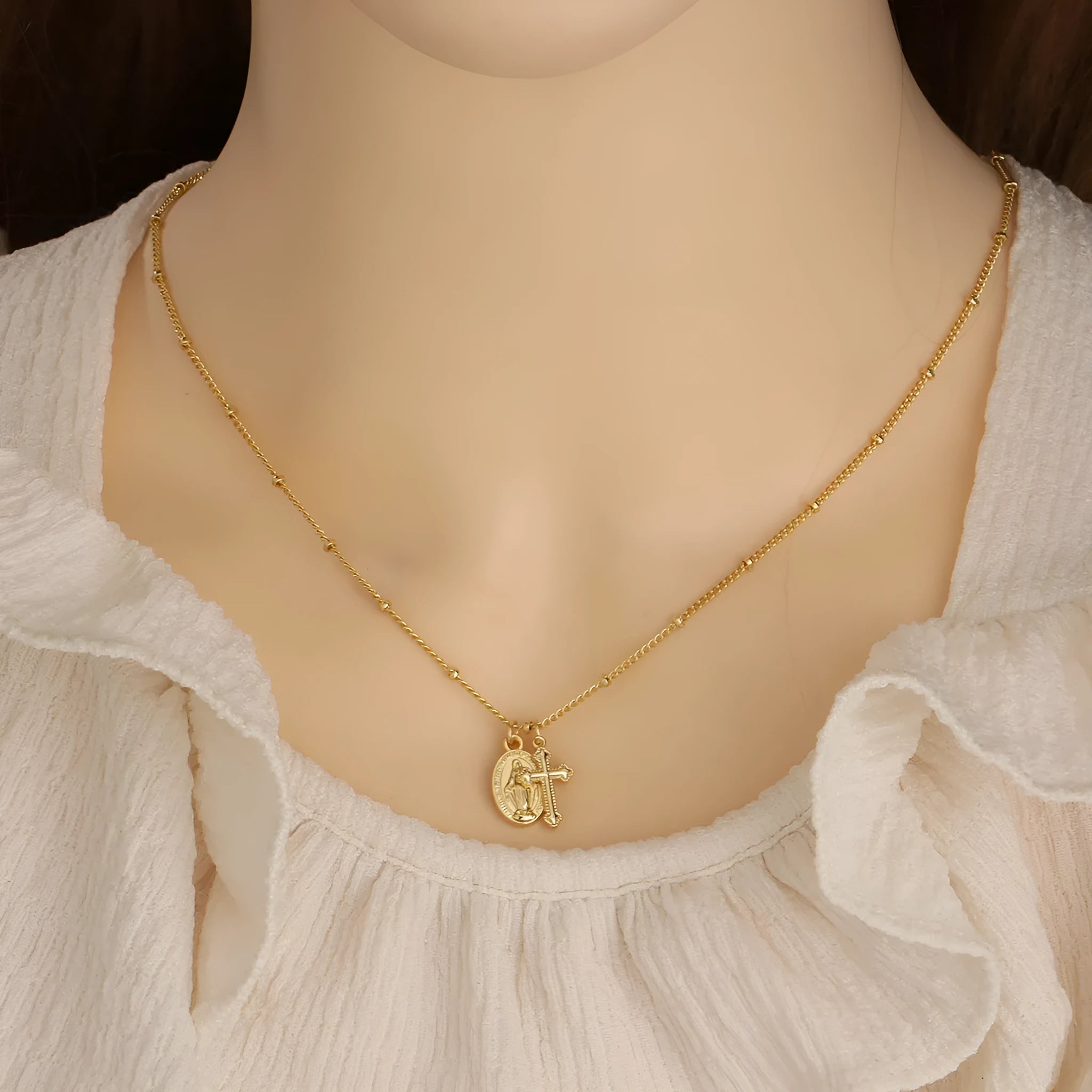Gold geometric cross necklace with Virgin Mary ornament for women