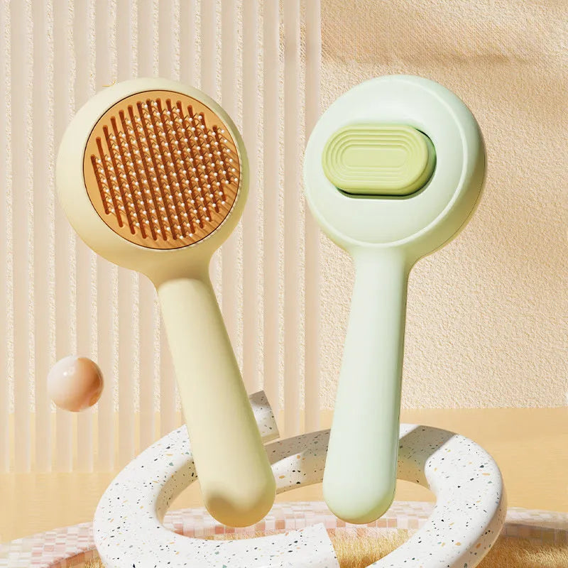Green and yellow pet grooming brushes with stainless steel pins and rubber handles.