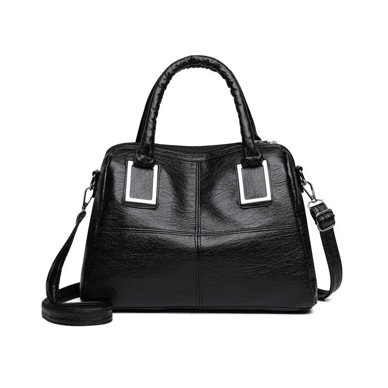 Simple large capacity women's shoulder bag in a square shape, shown in a neutral colour with visible structure.