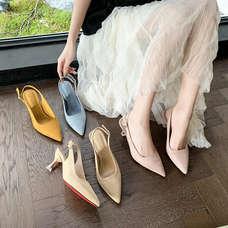 A pair of apricot suede pointed toe stiletto high heels with a rubber sole.