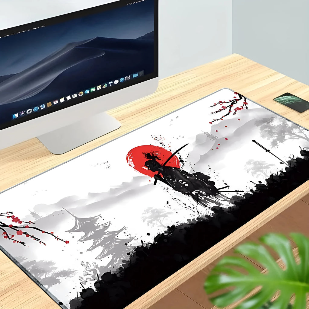 Japanese samurai design gaming mouse pad with cloth surface on a desk.