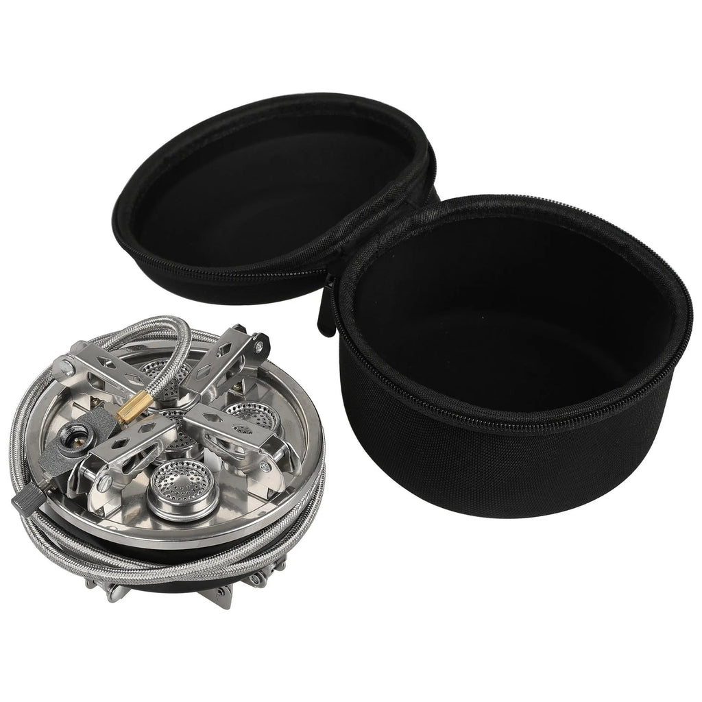 Silver foldable split camping stove with extended gas hose on a grey background