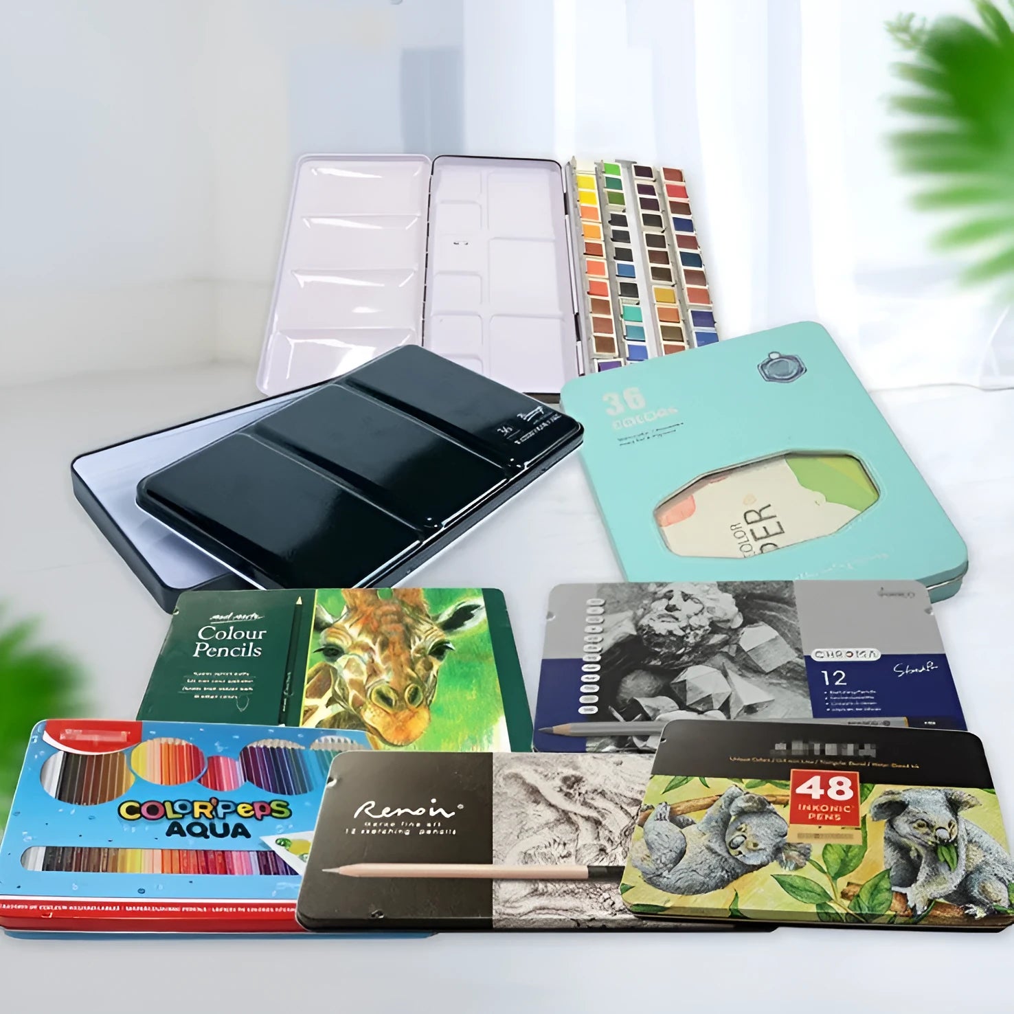 Solid square tinplate watercolour paint box with a three-fold empty interior.