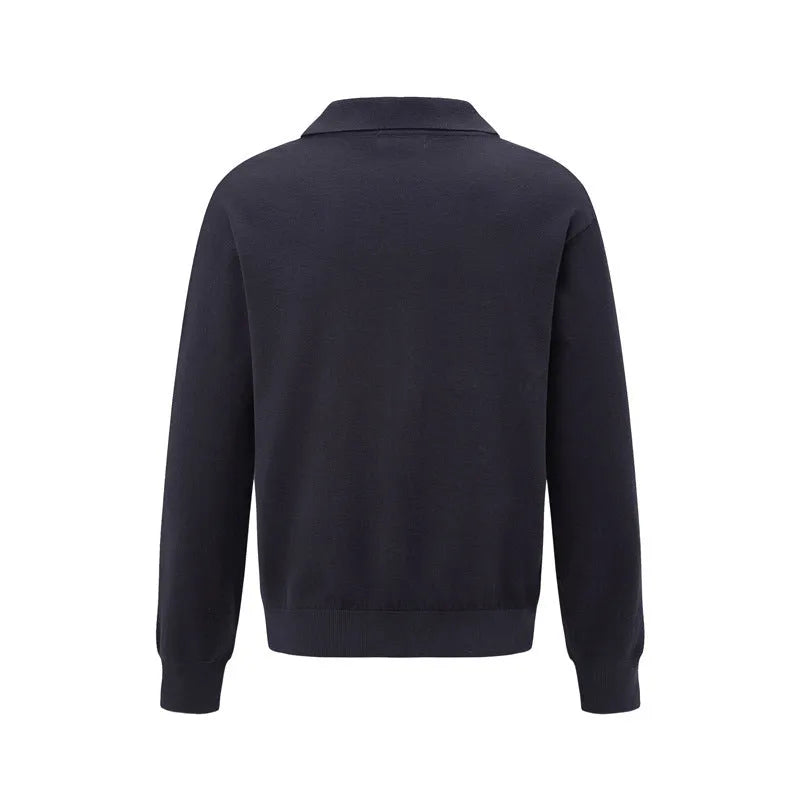 Man wearing a loose black pullover shirt, casual leisure wear.