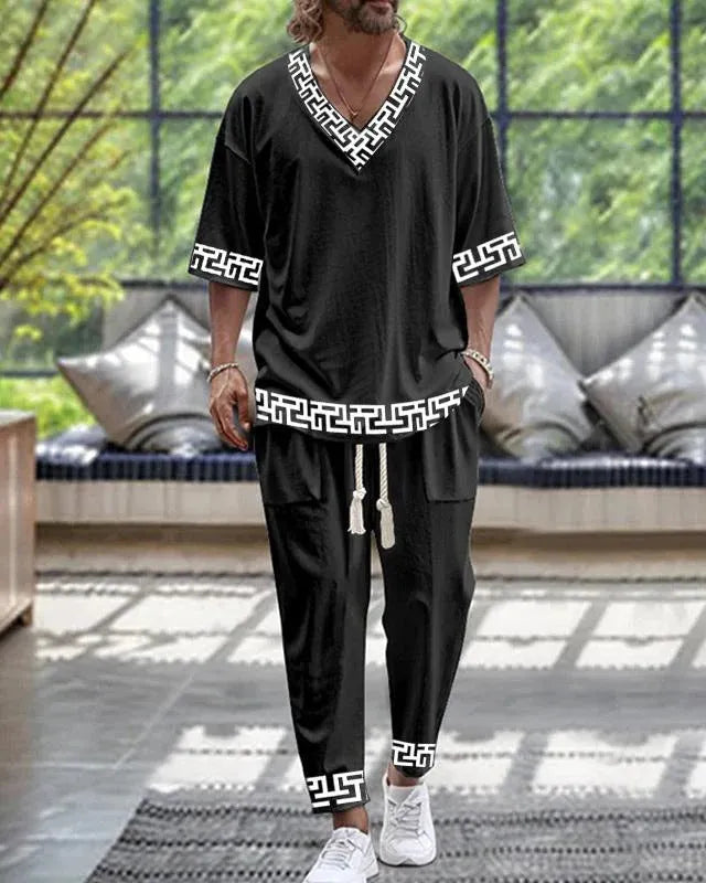 Cropped sleeve V-neck jacket and matching trousers in polyester fabric